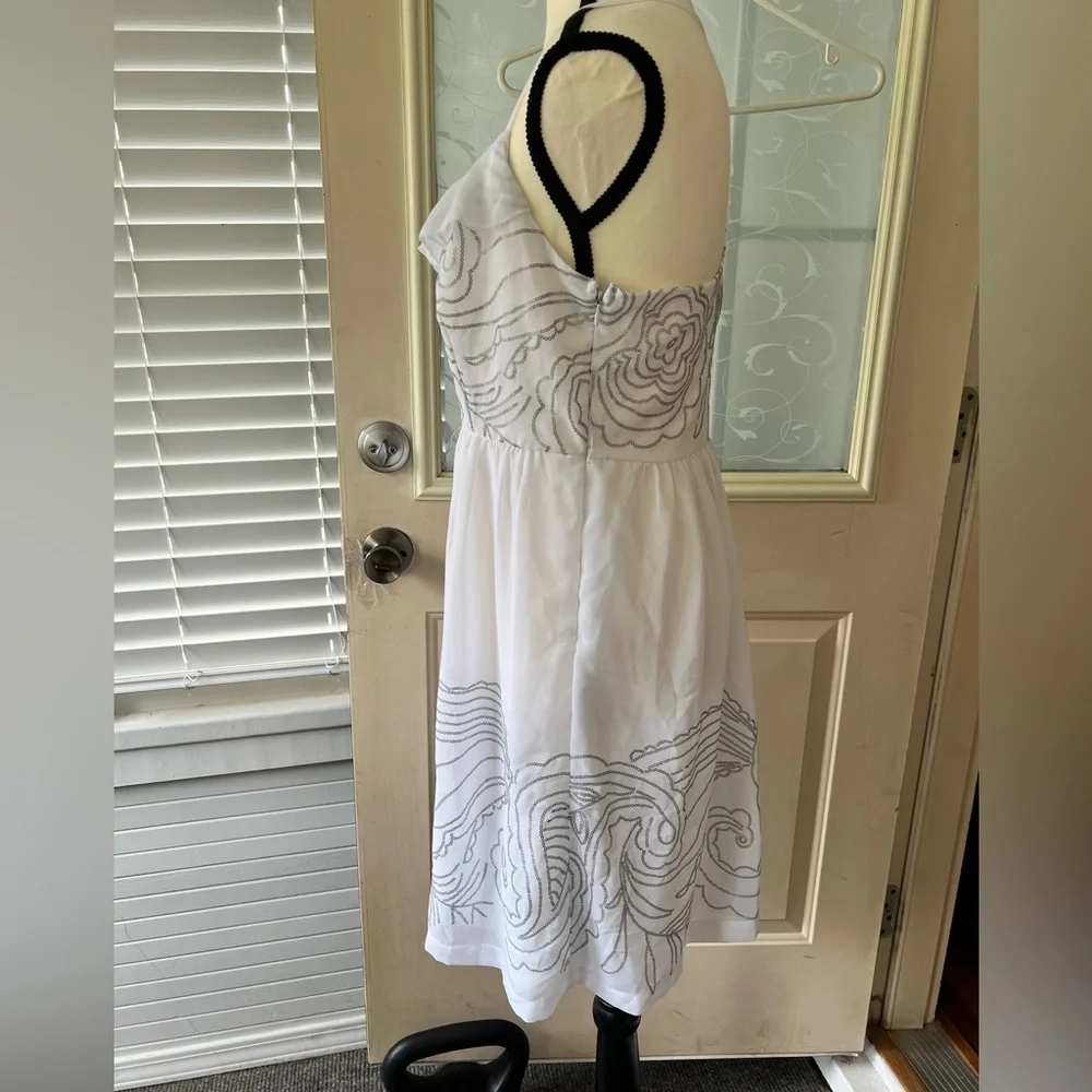 Johnny Martin size L white and silver floral Sequined dress. Racer back ruffled